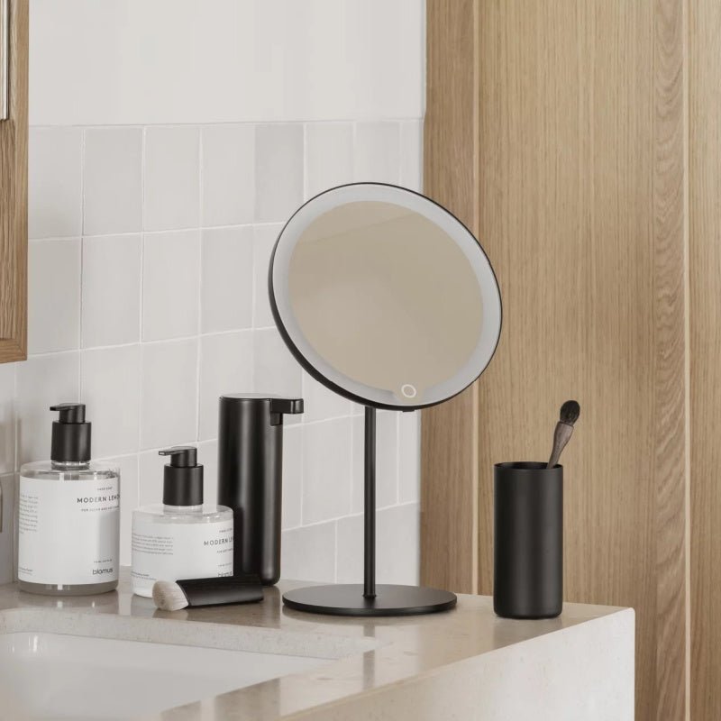 Tabletop Blomus LED Vanity Mirror, 5x - Black Matt - (Rechargeable) 66350 - mood photo installed in a bathroom - The Magnifying Mirror Store
